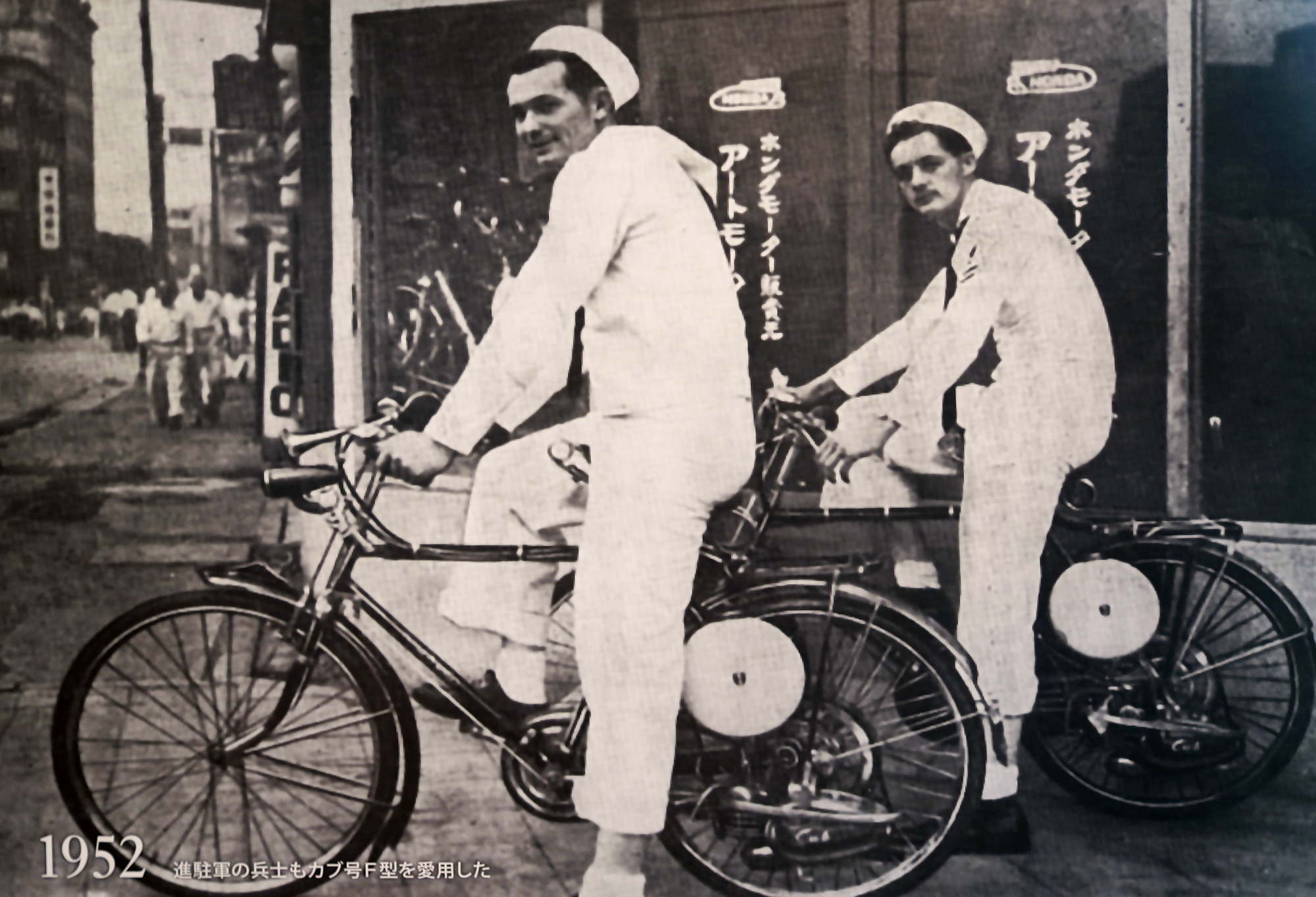 U.S. Navy personnel ride an early version of Honda’s 