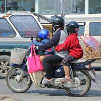 Honda\'s reliable Super Cub is widely sold in Southeast Asian markets. | GETTY IMAGES