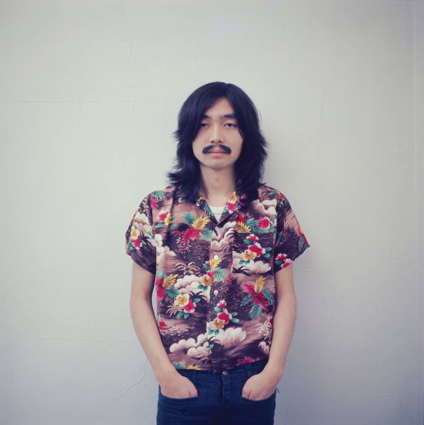 Haruomi Hosono poses for a picture in Sayama, Saitama Prefecture, in 1973. That same year Hosono released his debut solo album 'Hosono House.' | COURTESY OF MIKE NOGAMI/ VIA LIGHT IN THE ATTIC