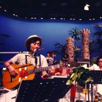 On screen: Haruomi Hosono takes part in a taping for the TV show \"Young Impulse\" in July 1975. | COURTESY OF THE MASASHI KUWAMOTO ARCHIVES/ VIA LIGHT IN THE ATTIC