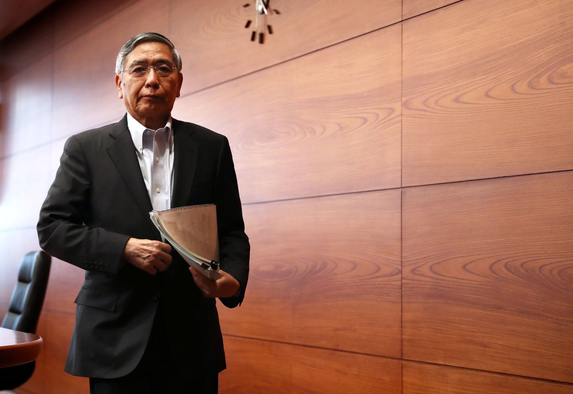 BOJ Gov. Haruhiko Kuroda departs from a press conference on Tuesday where he said that the central bank's policy shifts were aimed at making monetary stimulus more sustainable. | AFP-JIJI