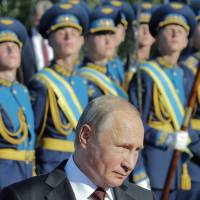 Russian President Vladimir Putin attends a ceremony to commemorate the 75th anniversary of the Battle of Kursk in World War II on Thursday. | REUTERS