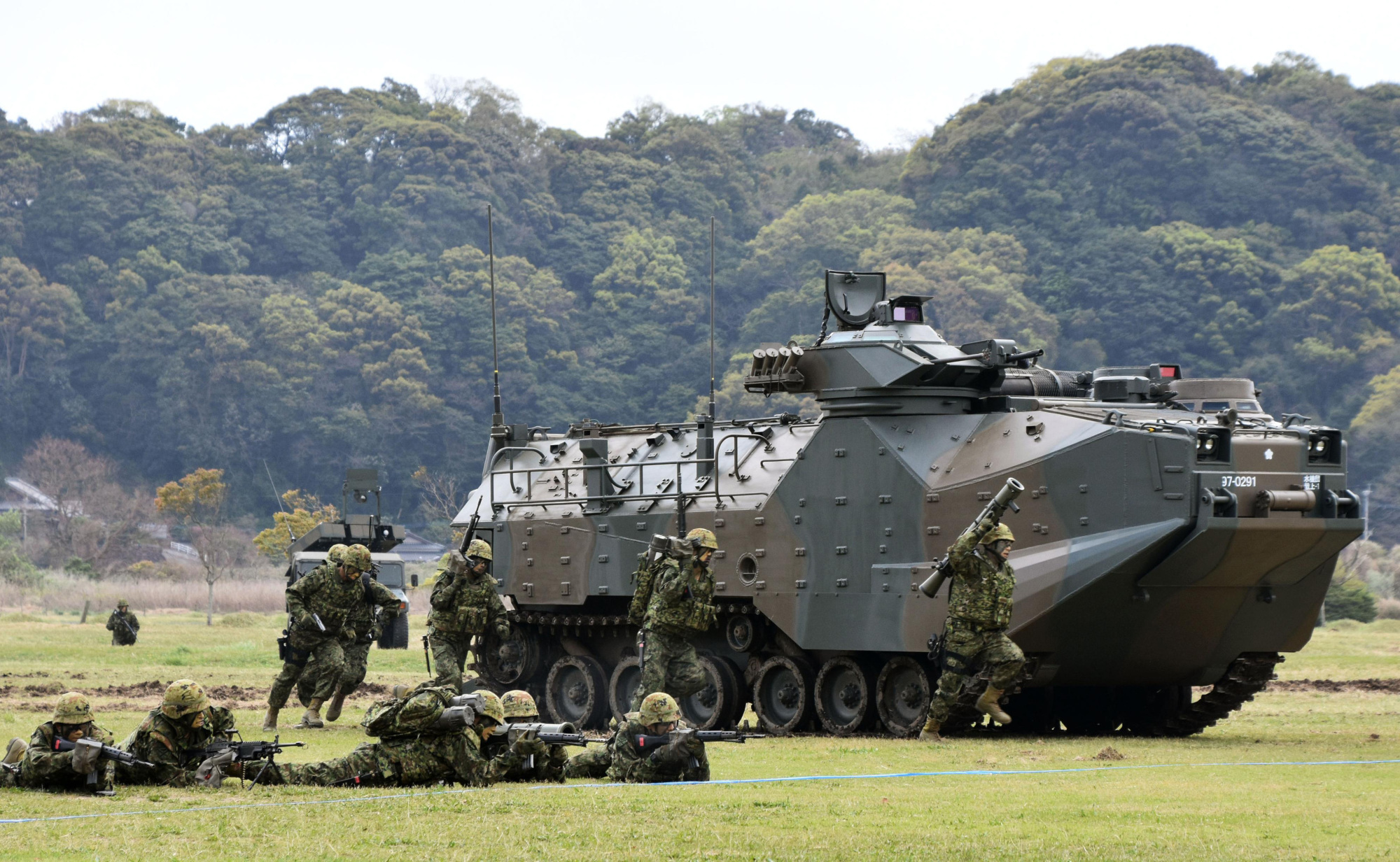 The Ground Self-Defense Force's new Amphibious Rapid Deployment Brigade carries out a demonstration exercise April 7 in Sasebo, Nagasaki Prefecture. | KYODO