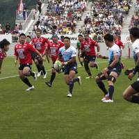 Yamaha Jubilo go on the attack during a game against Kamaishi Seawaves to inaugurate the opening of Kamaishi Unosumai Memorial Stadium on Aug. 19 in Kamaishi, Iwate Pref. | AP