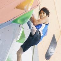 Tomoa Narasaki competes in bouldering qualification in the sport climbing men\'s combined event at the Asian Games on Friday in Palembang, Indonesia. | KYODO