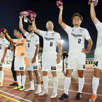 Andres Iniesta (8) and his Vissel Kobe teammates celebrate after a 2-0 win at Shonan Bellmare on Sunday. | KYODO