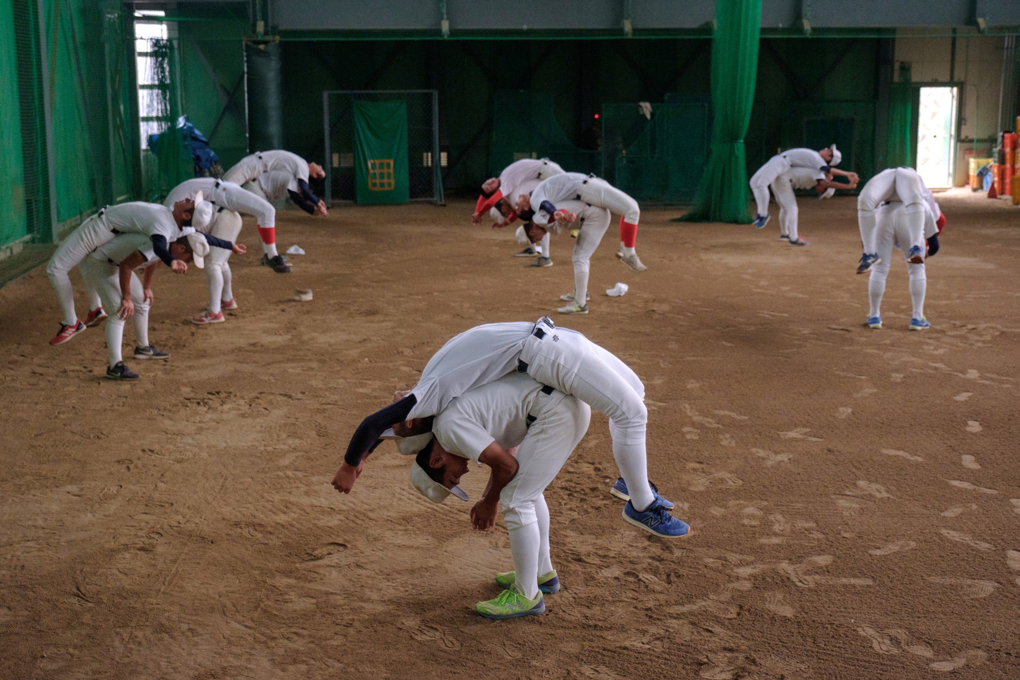 Chiben Wakayama players stretch during practice. | LANCE HENDERSTEIN