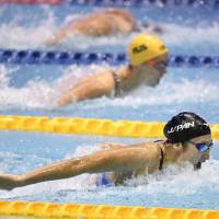 Rikako Ikee leads the pack in the women\'s 100-meter butterfly final at the Pan Pacific Swimming Championships on Saturday at Tokyo Tatsumi International Swimming Center. Ikee won the race in 56.08 seconds, a national record. | KYODO