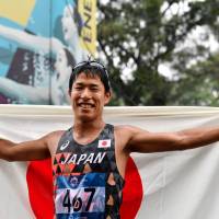 Hayato Katsuki celebrates after winning the men\'s 50-km race walk at the Asian Games in Jakarta on Thursday. | AFP-JIJI