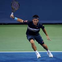 Kei Nishikori plays a shot from Stan Wawrinka in their second-round match at the Western &amp; Southern Open on Wednesday. | USA TODAY / VIA REUTERS