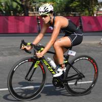 Yuko Takahashi competes in the cycling portion of the women\'s triathlon at the Asian Games on Friday in Palembang, Indonesia. | KYODO
