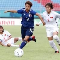 Japan\'s Mina Tanaka controls the ball in an Asian Games match against Vietnam on Tuesday in Palembang, Indonesia. Japan won 7-0, with Tanaka scoring two goals. | KYODO