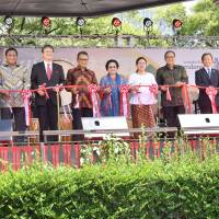 The opening ceremony of Festival Indonesia 2018 at Tokyo\'s Hibiya Park on July 29. Participants include (from left) Kesennuma Mayor Shigeru Sugawara; Rachmat Gobel, special envoy to the president of Indonesia; Iwao Horii, vice minister of foreign affairs; Indonesian Ambassador to Japan Arifin Tasrif; Megawati Soekarnoputri, the fifth president of Indonesia; Puan Maharani, coordinating minister for Indonesia\'s Human Development and Cultural Affairs; Anak Agung Gede Ngurah Puspayoga, minister of Cooperatives and Small &amp; Medium Enterprises; Japan-Indonesia Association Vice President Kojiro Shiojiri; and Warih Andang Tjahjono, president  of PT Toyota Motor Manufacturing Indonesia. | YOSHIAKI MIURA
