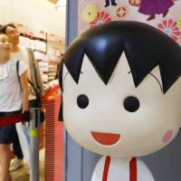 Shoppers visit the Tokyo Chibi Maruko-chan store at Tokyo Station on Tuesday, a day after the office of Momoko Sakura, creator of the long-running manga and anime series \"Chibi Maruko-chan,\" announced she had died of breast cancer. | KYODO