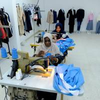 Women work in a sewing workshop supervised by a charity to help widows, divorcees and needy in Benghazi, Libya, Sept. 22. | REUTERS