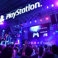Miniature versions of Sony\'s original PlayStation game consoles are showcased at a booth at the Tokyo Game Show on Thursday. | YOSHIAKI MIURA