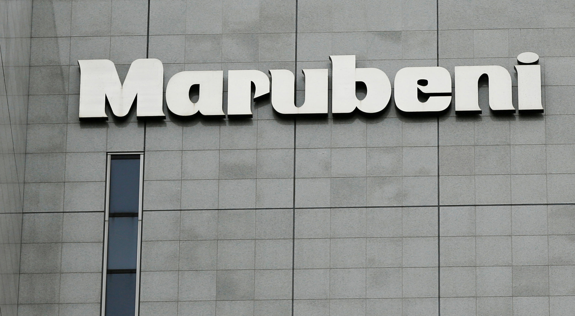 The logo of Marubeni Corp. is seen at the company headquarters in Tokyo on May 10, 2016. Marubeni said it will halve its net coal power-generating capacity by 2030. | REUTERS