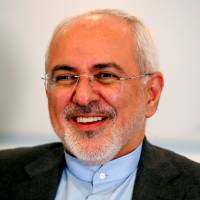 Iranian Foreign Minister Mohammad Javad Zarif smiles during a meeting with Swiss Foreign Minister Ignazio Cassis, in Bern, Switzerland, in July. | REUTERS