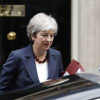 British Prime Minister Theresa May leaves No. 10 Downing St. to head to the House of Commons in London last Wednesday. | AFP-JIJI