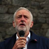Britain\'s Labour Party leader Jeremy Corbyn speaks at a vigil for peace in Yemen during the annual party conference held in the northwestern city of Liverpool on Sunday. | REUTERS