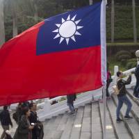 A Taiwanese flag is displayed at the National Palace Museum in Taipei last December. China on Sunday accused Taiwan\'s spy agencies of stepping up efforts to steal intelligence with the aim of \"infiltration\" and \"sabotage,\" and warned the island against further damaging already strained cross-strait ties. | BLOOMBERG