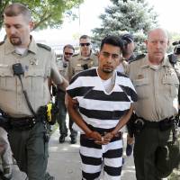 Cristhian Bahena Rivera is escorted into the Poweshiek County Courthouse for his initial court appearance in Montezuma, Iowa, Aug. 22. Rivera is charged with first-degree murder in the death of Mollie Tibbetts, who disappeared July 18 from Brooklyn, Iowa. Rivera pleaded not guilty during a court appearance Wednesday. | AP