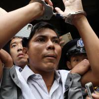Reuters journalist Kyaw Soe Oo leaves after listening to the verdict at a court in Yangon on Monday. | REUTERS
