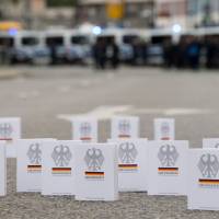 Numerous editions of the Federal Constitutional Law (Grundgesetz) are placed in the treet by supporters of the alliance Chemnitz Nazifrei\" (Chemnitz without Nazis) close to the place of a countermarch in Chemnitz, eastern Germany, on Saturday ahead a protest of the far-right Alternative for Germany (AfD) party and anti-Islam Pegida movement. The far-right demonstration was organised in a reaction to a knife killing, allegedly by an Iraqi and a Syrian, that set off anti-immigrant mob violence. | MONIKA SKOLIMOWSKA / DPA / VIA AFP-JIJI