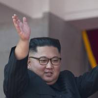 North Korean leader Kim Jong Un waves after a parade marking the 70th anniversary of the country\'s founding in Pyongyang on Sunday. | AP