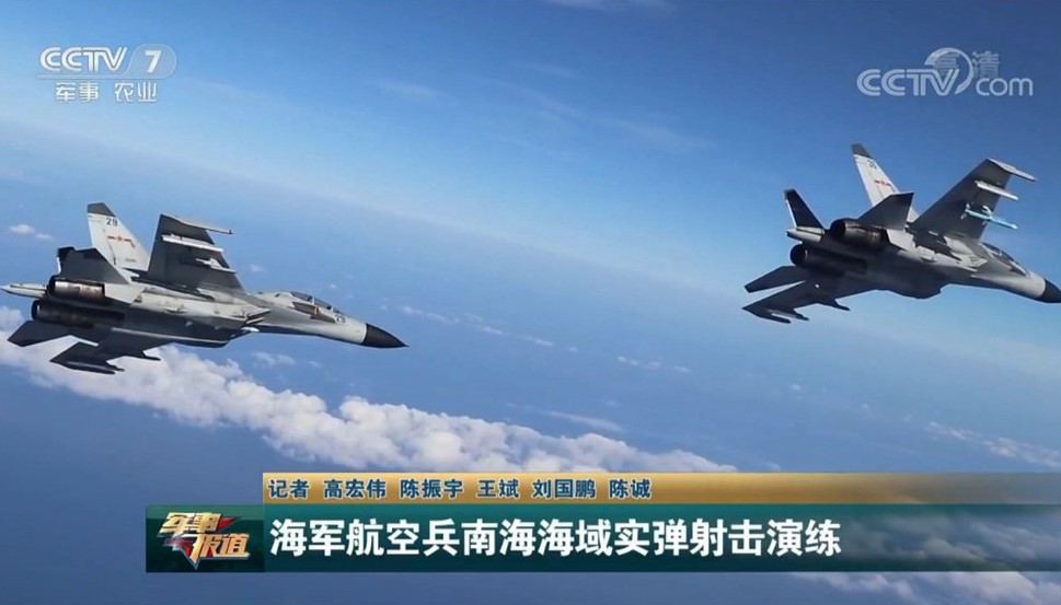 Chinese fighter planes conduct live-fire exercises at a range in the disputed South China Sea in this image taken by state broadcaster CCTV and posted Saturday to the Twitter account of the official People's Daily newspaper. | KYODO