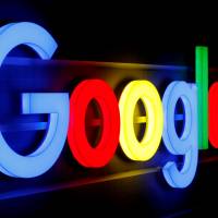 The Google logo is displayed on an office building in Zurich on Sept. 5. | REUTERS