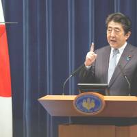 Prime Minister Shinzo Abe speaks at a news conference in Tokyo on July 20. | REUTERS