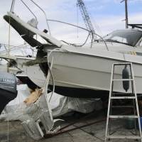 The badly damaged bow of a boat is seen after it slammed into a quay on Mukaishima Island in Hiroshima Prefecture on Sunday morning. Seven people were injured in the accident. | KYODO