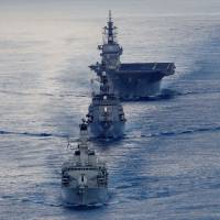 The British frigate HMS Argyll (front), Japanese destroyer Inazuma (center) and Japanese helicopter carrier Kaga take part in a joint naval drill in the Indian Ocean on Wednesday. | REUTERS