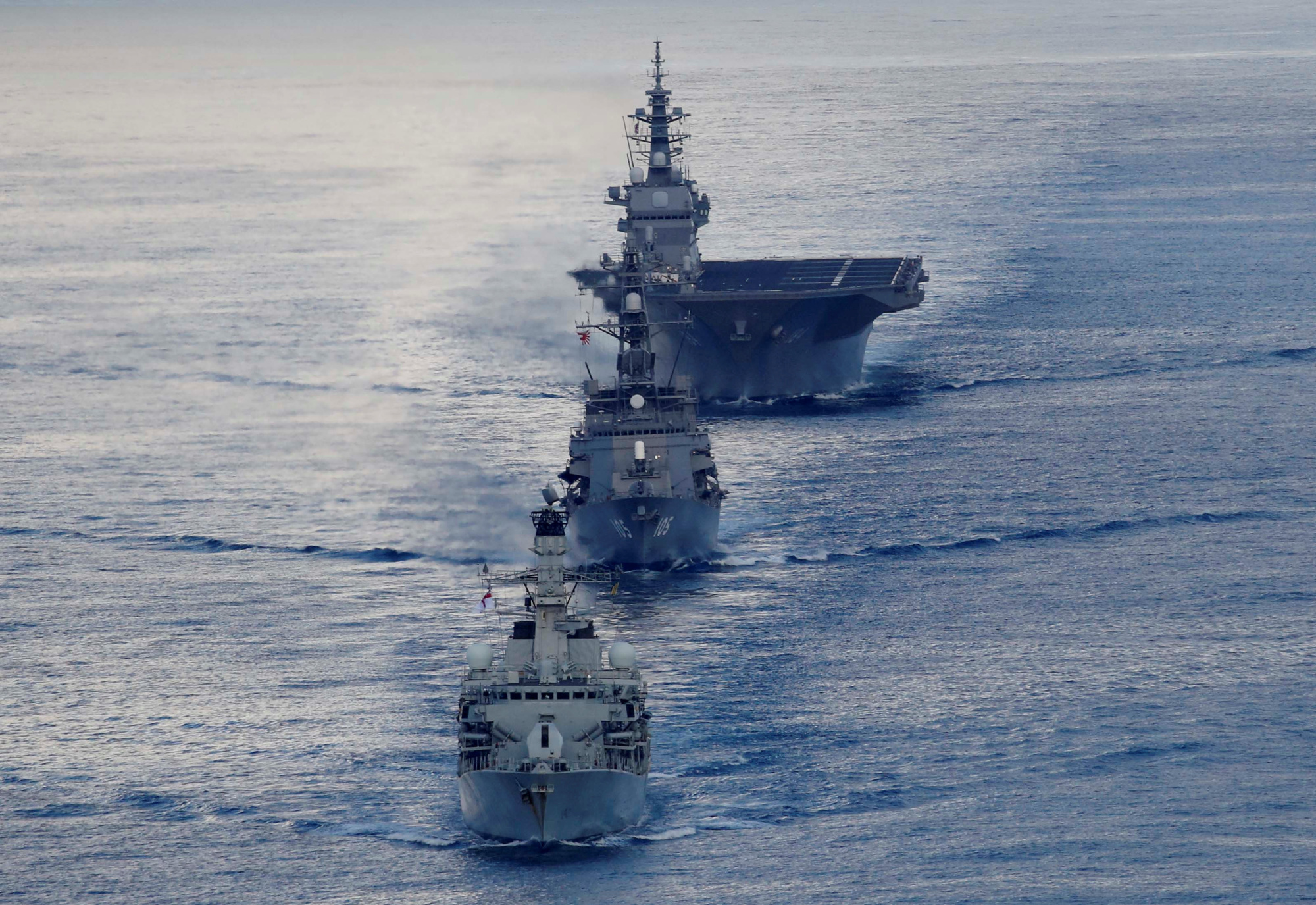 The British frigate HMS Argyll (front), Japanese destroyer Inazuma (center) and Japanese helicopter carrier Kaga take part in a joint naval drill in the Indian Ocean on Wednesday. | REUTERS