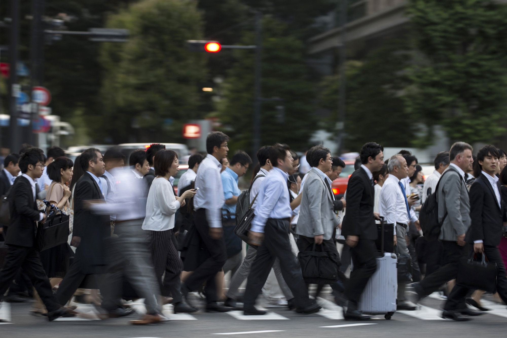 A Kyodo News survey showed that only 13 of 113 major firms polled are considering adopting the 