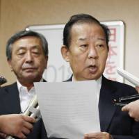 LDP Secretary-General Toshihiro Nikai speaks to reporters Thursday at the party\'s headquarters in Tokyo. | KYODO