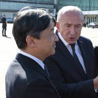 Crown Prince Naruhito is welcomed by French Interior Minister Gerard Collomb at Lyon\'s airport on Friday. | AP