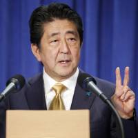 Prime Minister Shinzo Abe speaks at a news conference in New York on Wednesday following talks with U.S. President Donald Trump. | KYODO