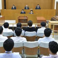 The Naha branch of the Fukuoka High Court on Thursday upheld a lower court\'s ruling that sentenced Kenneth Franklin Shinzato, a former U.S. military base worker, to life in prison. | POOL / VIA KYODO