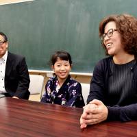 Nine-year-old Yuko Fushimi (center) and her mother, Chieko, speak during an interview at Asahi Elementary School in Tokyo\'s Toshima Ward as the school\'s principal, Shinya Kadowaki, looks on. | YOSHIAKI MIURA