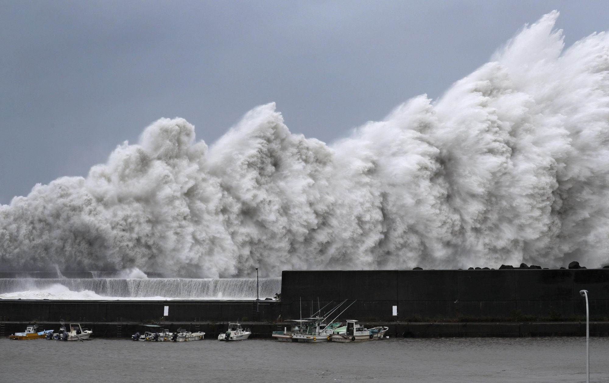 High waves are observed at a fishing port in Aki, Kochi Prefecture, on Tuesday as Typhoon Jebi approaches western Japan. | KYODO