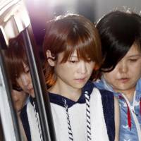 Hitomi Yoshizawa is seen in front of Nakano Police Station on Thursday after being arrested for an alleged hit-and-run incident involving drunken driving. | KYODO