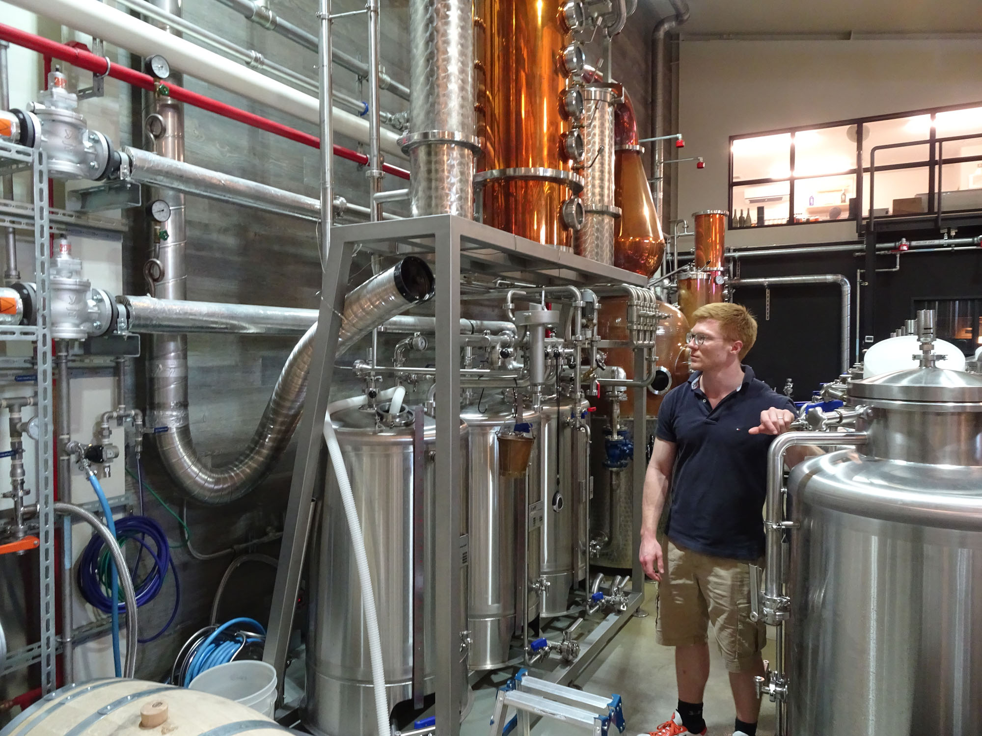 Alex Davies, head distiller of Kyoto Distillery, inspects his work in August.