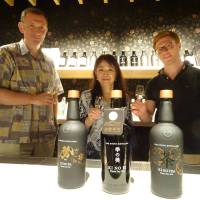 David Croll, founding partner of Kyoto Distillery (left), enjoys a glass of Ki no Bi gin with his colleagues in August. | ERIC JOHNSTON