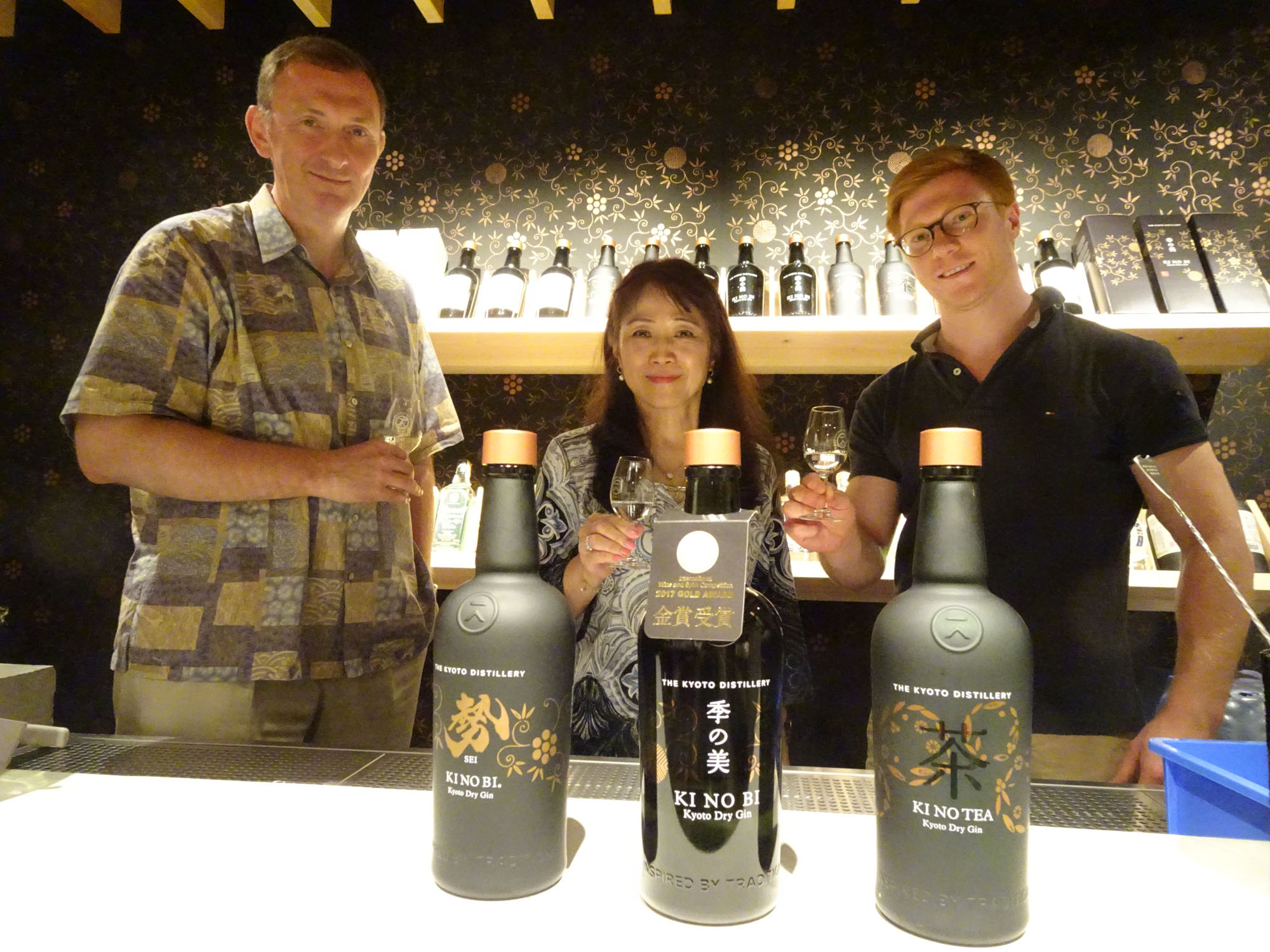 David Croll, founding partner of Kyoto Distillery (left), enjoys a glass of Ki no Bi gin with his colleagues in August.