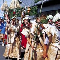 March of the merrymakers: A parade of men dressed in makeshift samurai outfits march in honor of samurai Yanobe Heiroku. | KYODO