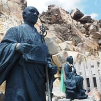 Summit approach: Stone statues at a shrine at one of the minor summits of Mount Ontake. | TOM FAY