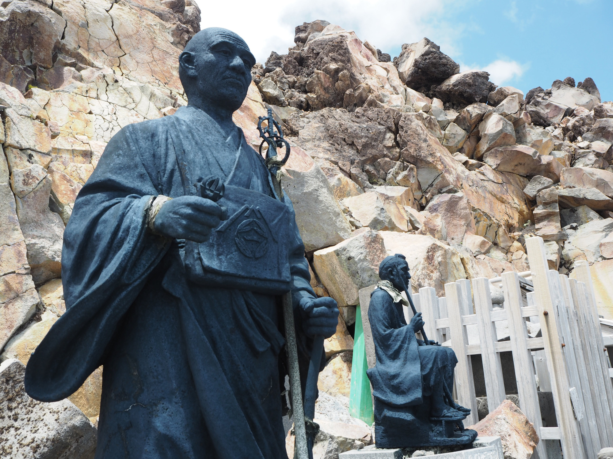 Summit approach: Stone statues at a shrine at one of the minor summits of Mount Ontake. | TOM FAY