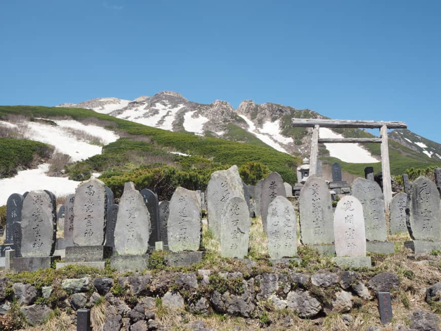 Sacred ground: A torii gate and stone monuments halfway up the mountain.